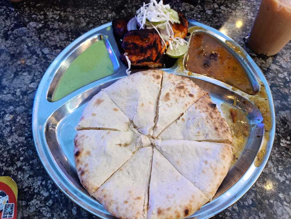 Tandoori chicken with naan is a must-try.
