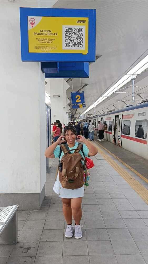 Traveler at Padang Besar Railway Station on the Malaysian side, preparing to walk to the Thai border.