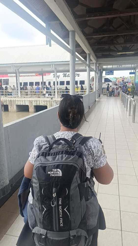 Travelers boarding the ferry at Kuah Jetty.