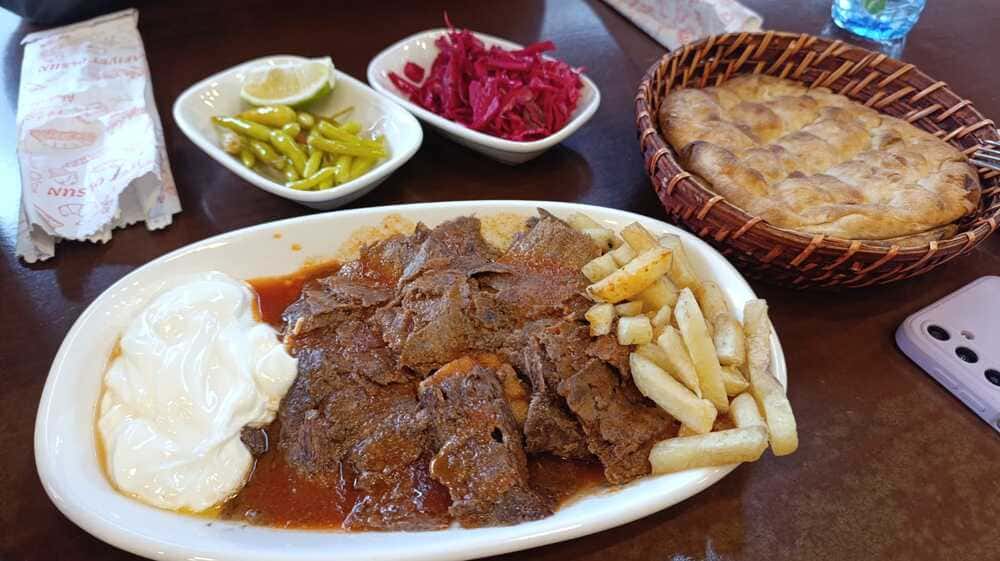 Grilled lamb kebab with fries and yogurt